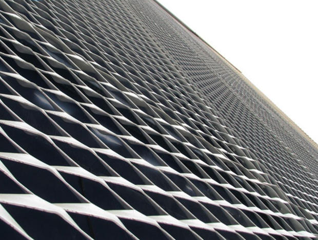 Are there any specific industry standards or quality control methods for flattened expanded metal?